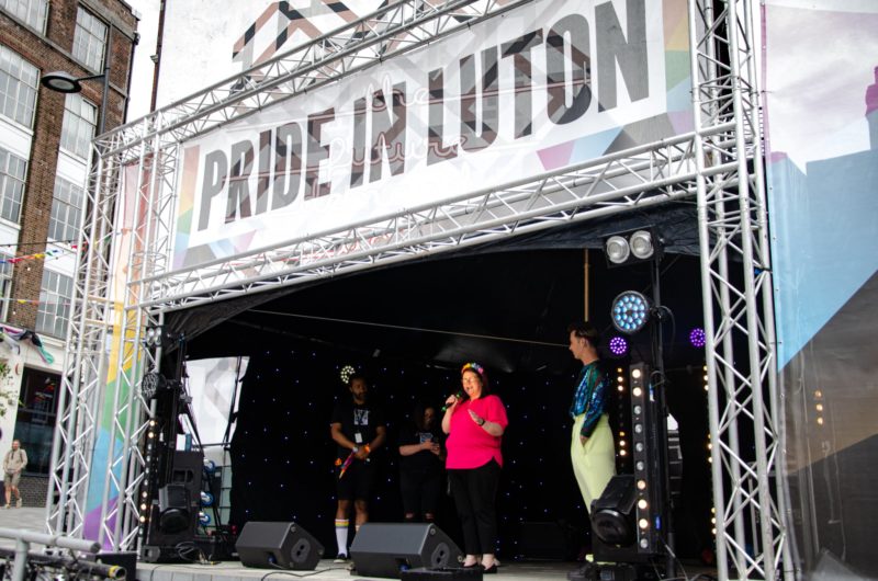 Rachel giving a speech at Pride in Luton