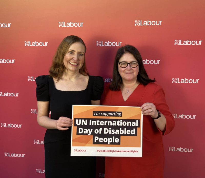 Rachel Hopkins MP and Vicky Foxcroft MP holding sign saying 
