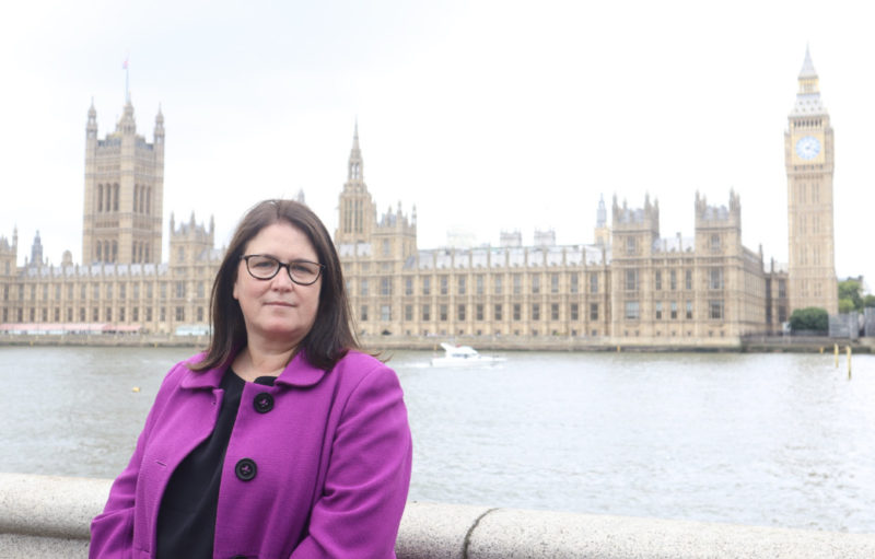 Rachel Hopkins MP in purple jacket in front of Parliament