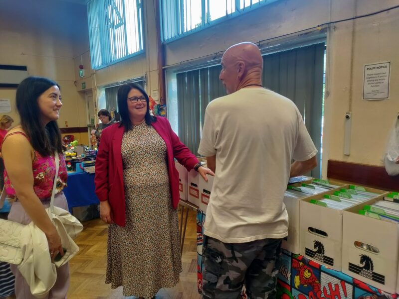 Rachel and Sarah talking one of the stall holders, he is also a postie!